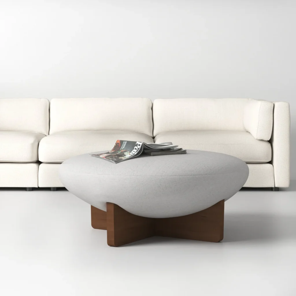 A Soft Upholstered Ottoman on a Wooden Cross Base