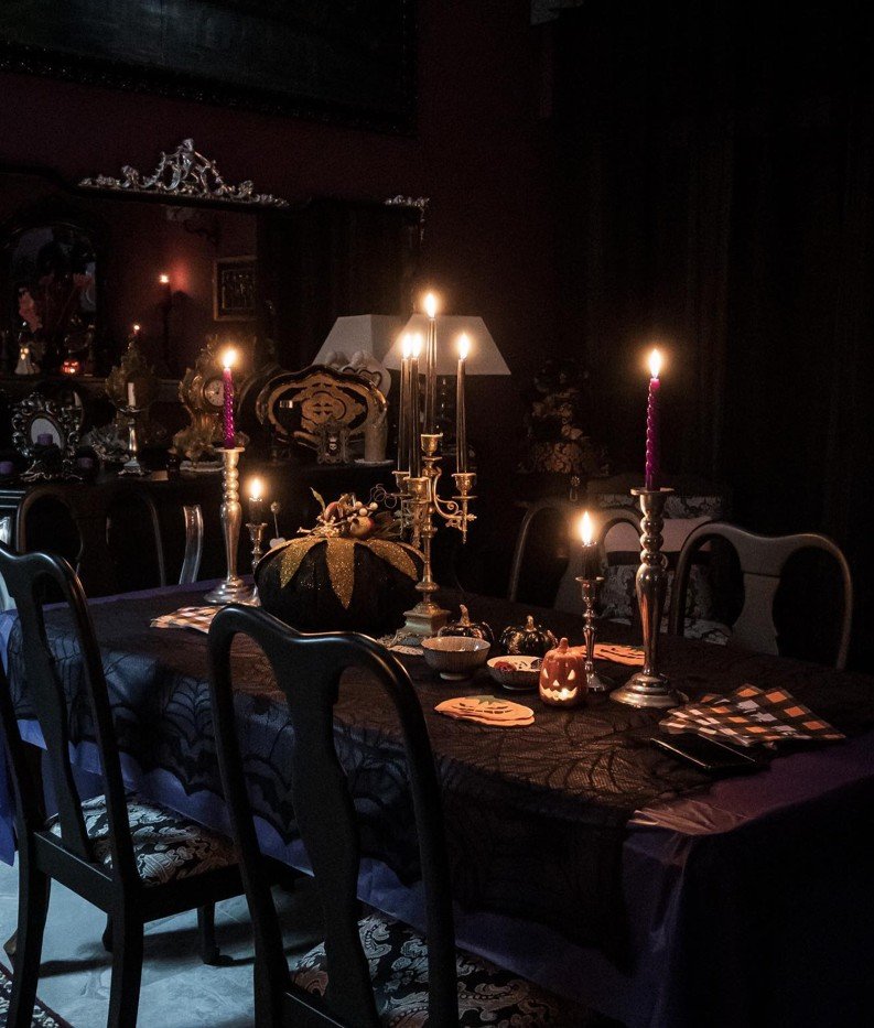 Candlelit Victorian Dining Table With Black Lace and a Brass Candelabra