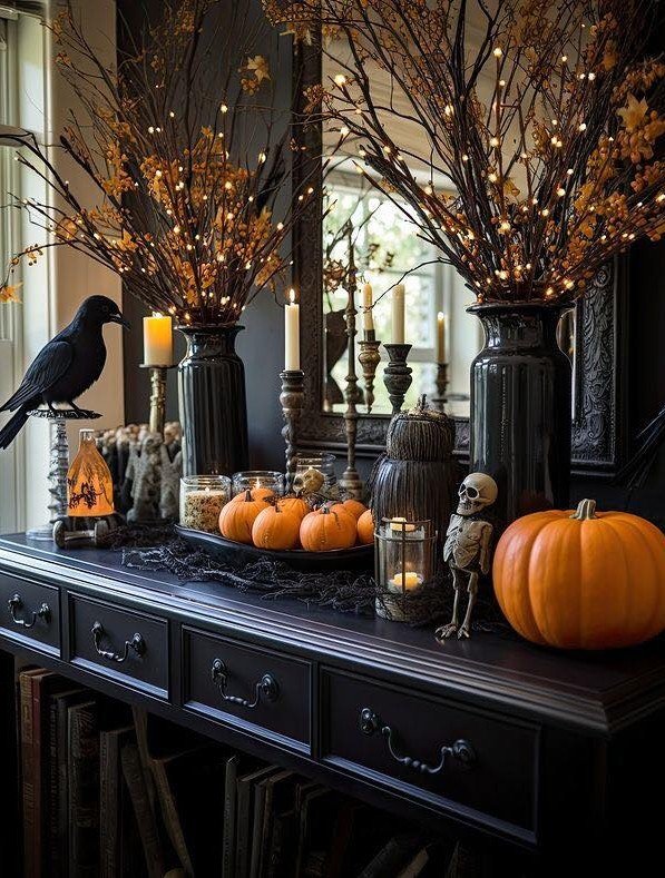 Dress a Console Table With Lit Branches, Candles, and a Raven