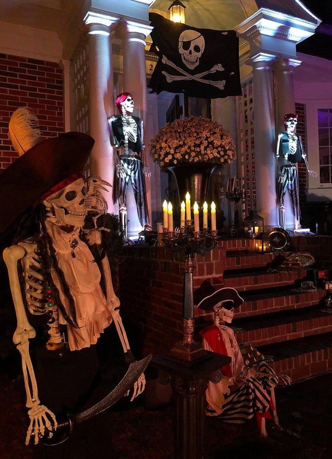 Skeleton Crew Porch Steps With a Pirate Flag and Candlelight