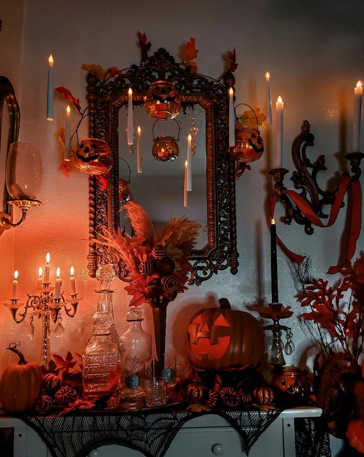 Victorian Sideboard With Floating Candles and an Ornate Mirror